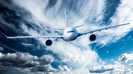 Passenger Airliner flying in the clouds